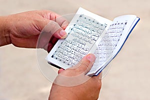 Man Reading Yassin From The Holy Quran