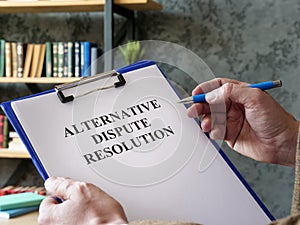 Man reads about alternative dispute resolution ADR.