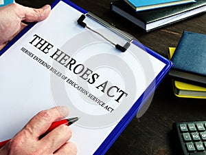 Man reads HEROES Act or Health and Economic Recovery Omnibus Emergency Solutions Act