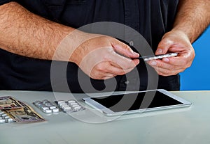 Man reads medical pills for using tablet prescribing screen surface