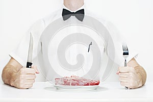 Man ready to eat raw steak