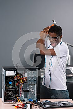 Man ready to hit computer photo