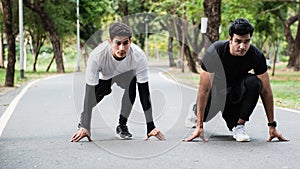 Man ready to start running with his friend