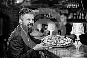 Man received delicious pizza. Enjoy your meal. Cheat meal concept. Hipster hungry eat italian pizza. Pizza favorite