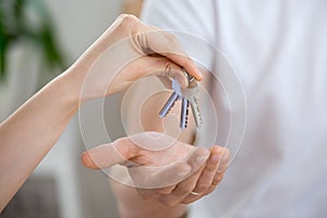 Man receiving keys from real estate agent