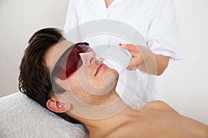 Man Receiving Laser Hair Removal Treatment