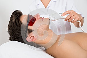 Man Receiving Laser Hair Removal Treatment