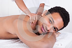 Man Receiving Massage From Female Hand