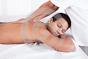 Man Receiving Massage From Female Hand