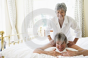 Man receiving a massage from a woman