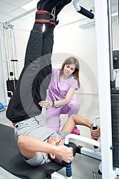 Man receiving physiotherapy rehabilitation treatment in clinic