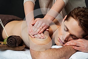 Man receiving relax treatment at spa
