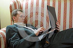 Man reclining with laptop