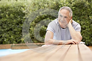 Man Reclining By Poolside