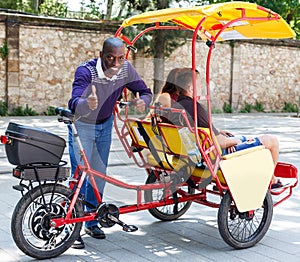 Man recommending traveling with rickshaw