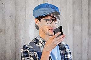 Man recording voice or calling on smartphone