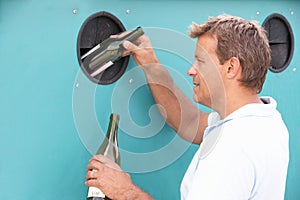 Man At Recycling Centre At Bottle Bank