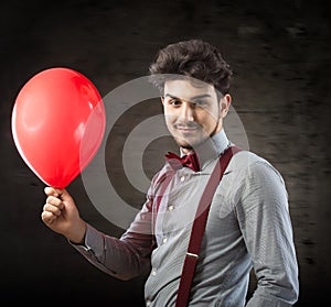 Man with a red balloon