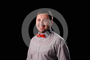 man with red butterfly tie