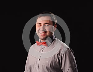 man with red butterfly tie