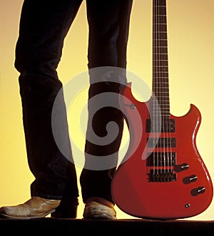 Man with red electric guitar