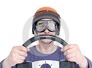 Man in red helmet and goggles with steering wheel, isolated on white background. car driver concept