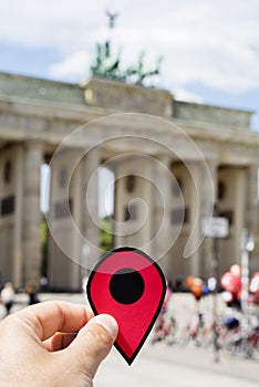 Man with a red marker in the Brandenburg Gate