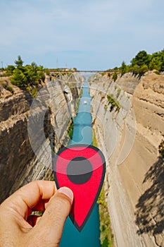 Man with a red marker at the Corinth Canal, Greece