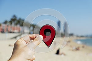 Man with a red marker in La Barceloneta beach photo