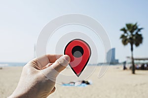 Man with a red marker in La Barceloneta beach photo