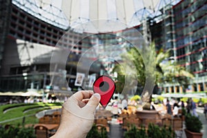 Man with a red marker at Sony Center in Berlin