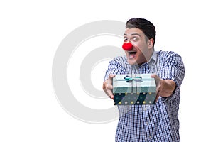 Man with a red nose funny holding a shopping bag gift present is