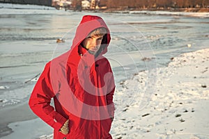 Man in red parka. winter male fashion. warm clothes for cold climate. weather forecast. human and nature. man walking