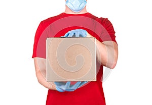 Man in red t-shirt and blue medical glove holding cardboard box isolated white
