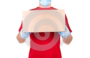 Man in red t-shirt and blue medical gloves holding cardboard box isolated white