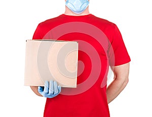 Man in red t-shirt and blue medical gloves holding cardboard box isolated white