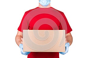 Man in red t-shirt and blue medical gloves holding cardboard box isolated white