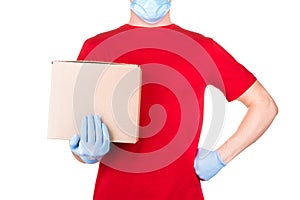 Man in red t-shirt and blue medical gloves holding cardboard box isolated white