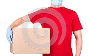 Man in red t-shirt and blue medical gloves holding cardboard box isolated white