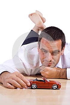 Man with red toy car