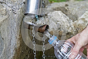 A man refilling spring water photo