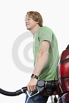 Man Refueling His Car Over White Background
