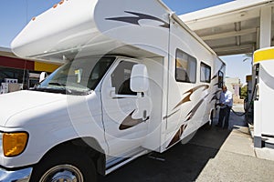 Man Refueling RV photo