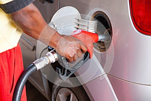 Man refuelling car with petrol or diesel at the petrol station