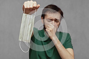 A man refuses to wear a medical mask and sneezes