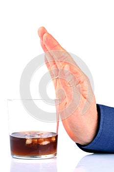 Man refusing a glass of alcohol on white background