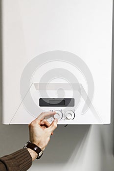 Man regulate power heating boiler control panel photo