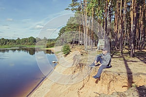 Man relax on the river bank