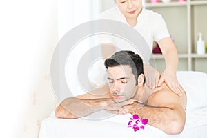 Man relax in skin care aroma therapy and scrub spa, in Thailand resort
