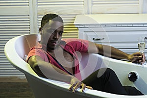 Man on relaxed face relaxing in bathtub. Luxury life concept. Man with beard and mustache indoor, interior background